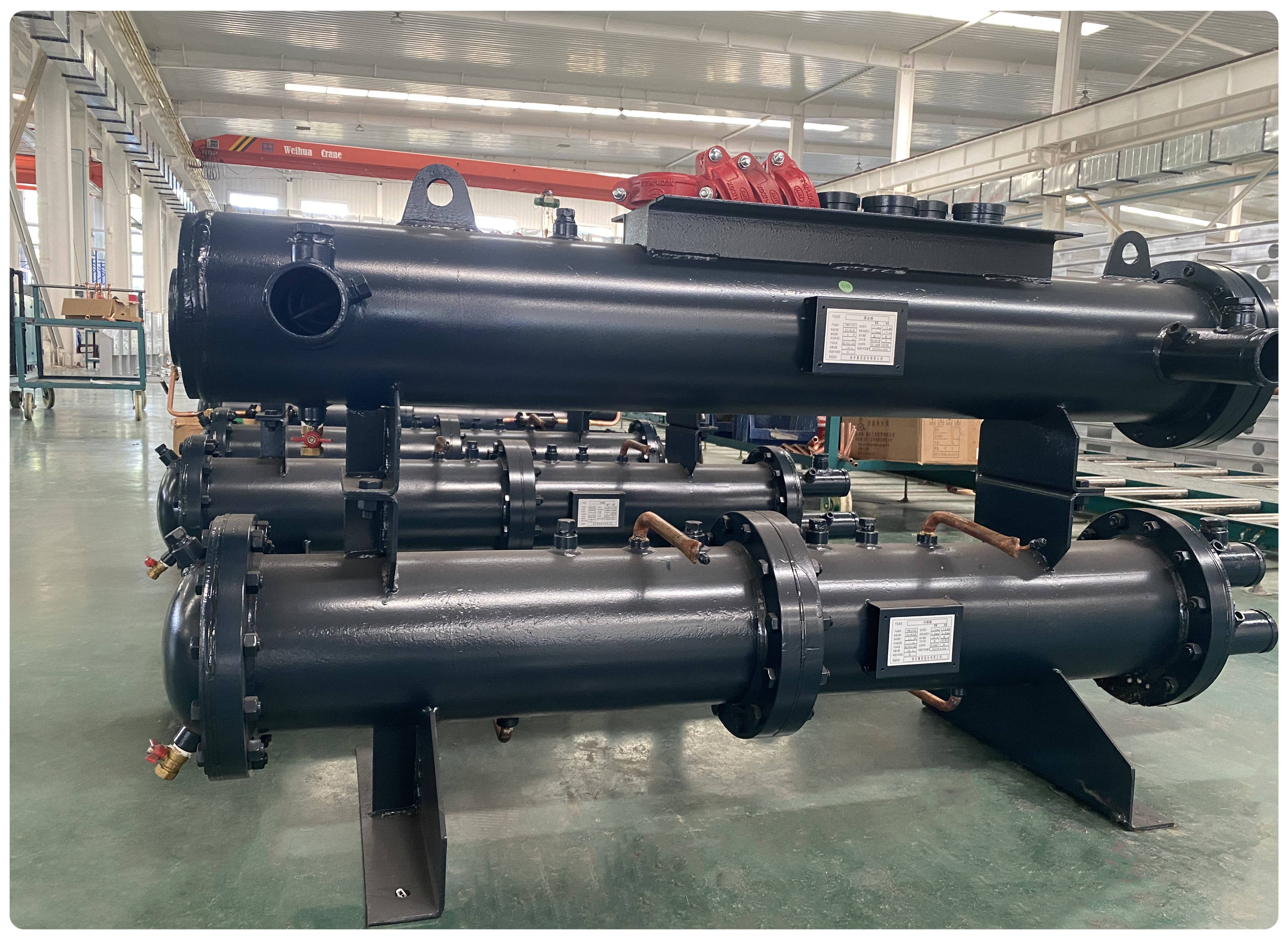 Figure 4 Shell and tube condenser الشكل 4 قذيفة وأنبوب المكثف